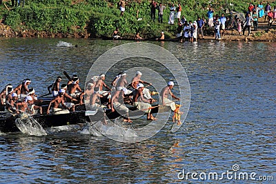 Oarsmen wearing traditional kerala dress row thier snake boat in the Aranmula boat race Editorial Stock Photo