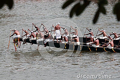 Oarsmen wearing traditional kerala dress row thier snake boat in the Aranmula boat race Editorial Stock Photo