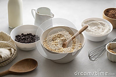 Oat flakes, old fashion close up oat flakes in a bowl. Chocolate oats brownies ingredients, cooking pastry, muffins Stock Photo