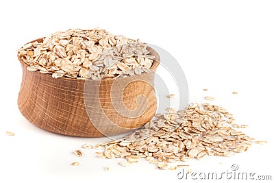 Oat flakes in a wooden bowl isolated on white background Stock Photo