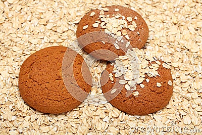 Oatcakes on rolled oats background Stock Photo