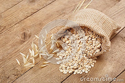 Oatmeal in bag on table Stock Photo