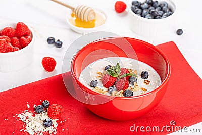 Oatmeal Breakfast in Bowl with Fruit Berries Stock Photo