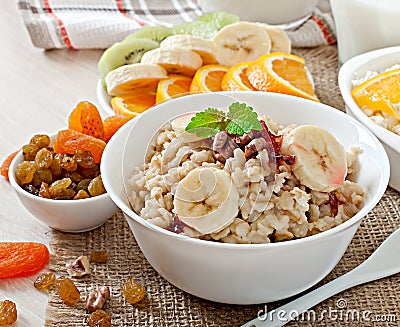 Oatmeal, cottage cheese, milk and fruit Stock Photo
