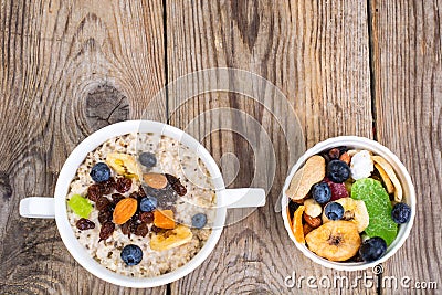 Oatmeal with fruit and nuts-hearty and tasty breakfast Stock Photo