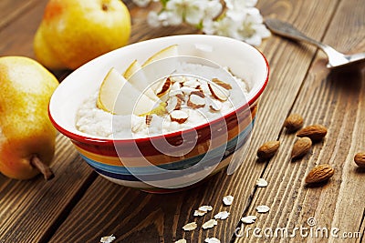 Oatmeal with pear and almonds Stock Photo