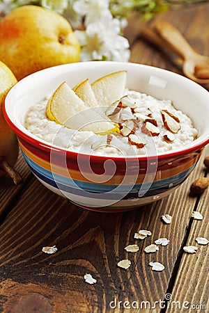 Oatmeal with pear and almonds Stock Photo