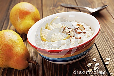 Oatmeal with pear and almonds Stock Photo