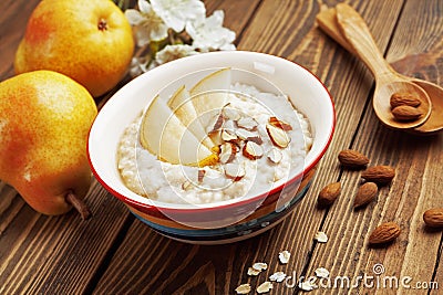 Oatmeal with pear and almonds Stock Photo