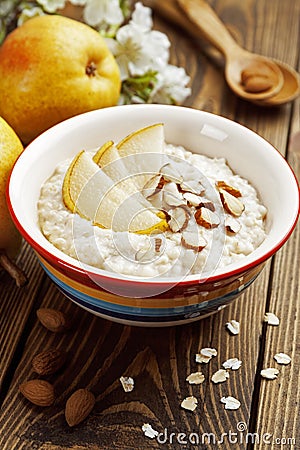 Oatmeal with pear and almonds Stock Photo