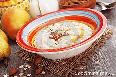 Oatmeal with pear and almonds Stock Photo