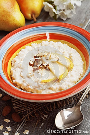 Oatmeal with pear and almonds Stock Photo