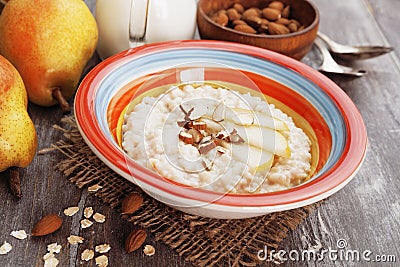 Oatmeal with pear and almonds Stock Photo