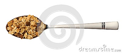 Oatmeal, raisins, cashews and almonds. Granola in metal spoon Stock Photo