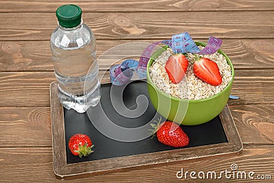 Oatmeal, strawberries and water Stock Photo