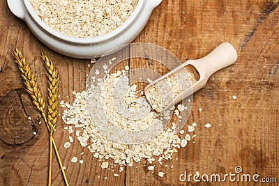 Oat flakes with a wooden spoon Stock Photo