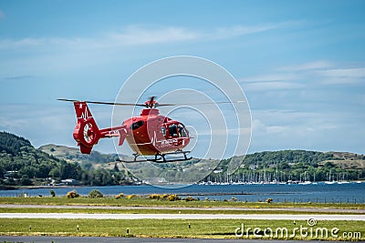 Oban Scotland - May 17 2017: Red Air ambulance starting to fly back to Ireland Editorial Stock Photo