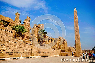 Obelisk, Inner view of a temple and carved pillars of the great hypostyle hall in the Precinct of Amon Re, Situated at Karnak Temp Editorial Stock Photo