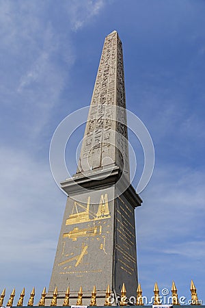 The Obelisk of Luxor on the Place de la Concorde in sunny day. Famous sight of Paris. Luxor obelisk close up and hieroglyphics on Editorial Stock Photo