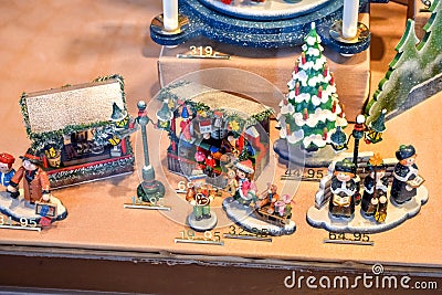 OBERAMMERGAU, GERMANY - OKTOBER 09, 2018: Christmas tree toys in a shop window with a price Editorial Stock Photo