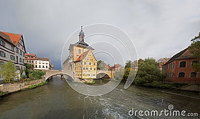 Obere bridge (brÃ¼cke) and Altes Rathaus and cloudy sky in Bamberg Stock Photo