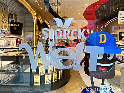 View on display window of store with logo lettering of storck welt sweets company in shopping mall Editorial Stock Photo