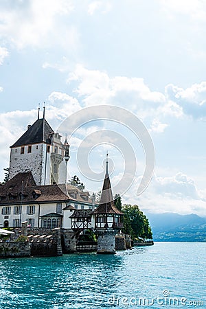 Oberhofen Castle with Thun Lake background in Switzerland Editorial Stock Photo