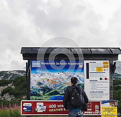 Road sign and map in Dachstein Mountains, Austria Editorial Stock Photo