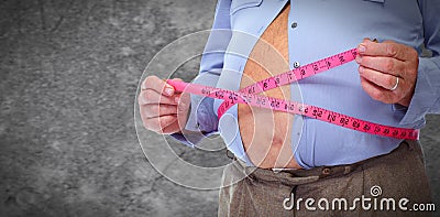 Obese man abdomen with measuring tape. Stock Photo