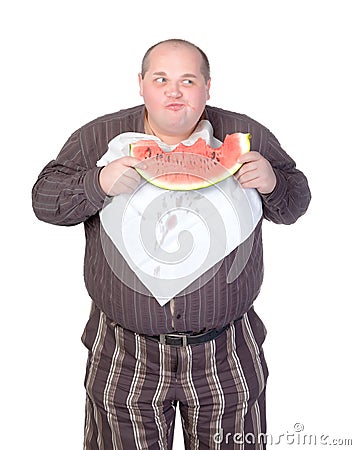 Obese man eating watermelon Stock Photo