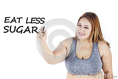 Obese woman writes eat less sugar word Stock Photo