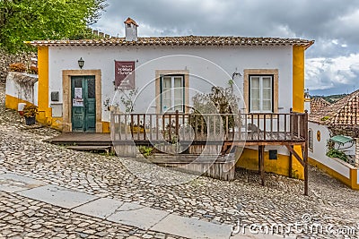 View of a Portuguese vernacular buildings on medieval village inside the fortress and Luso Roman castle of Ã“bidos Editorial Stock Photo