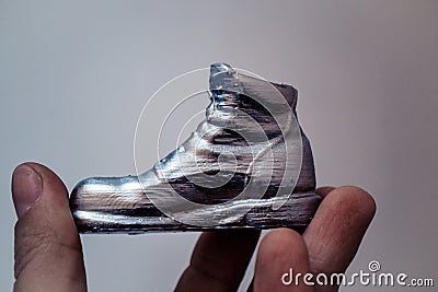 Object in the form of a boot printed on a 3d printer and covered with enamel Stock Photo