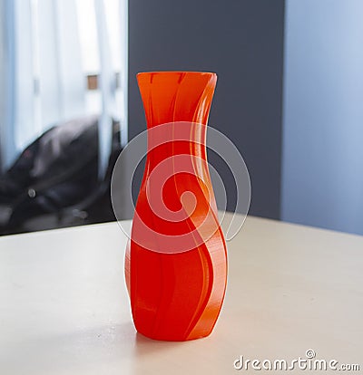 Object form vase of red color printed on a 3D printer. Three-dimensional model Stock Photo