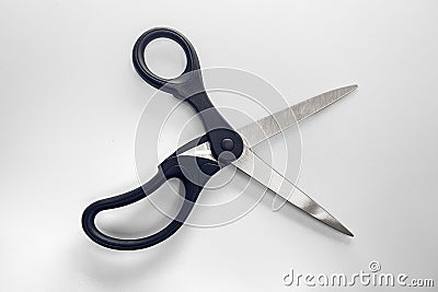 Object metal stainless steel and black plastic scissors opened o Stock Photo