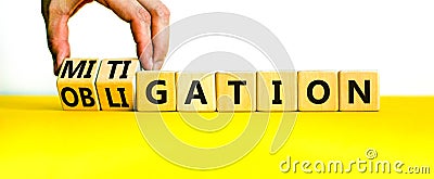 Obligation and mitigation symbol. Businessman turns wooden cubes changes the concept word obligation to mitigation. Beautiful Stock Photo