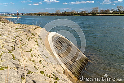 An oblique sewer that flows into the Rhine River in western Germany. Stock Photo