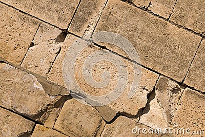 Oblique stone background tower part beige block wall rigid protective structures base design grand urban pattern Stock Photo