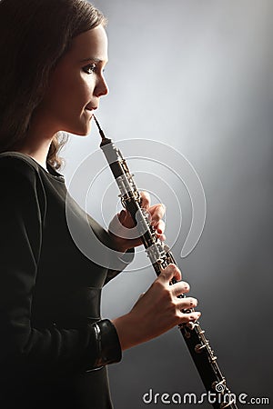 Oboe player oboist playing music instrument Stock Photo