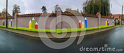 Brick fence of kindergarten with painted on colorful crayons Editorial Stock Photo