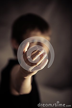 Obscured person with beckoning gesture Stock Photo