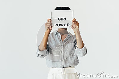 obscured view of african american woman with girl power in hands board Stock Photo