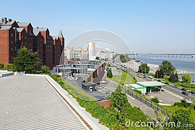 The observation deck in the park overlooks the city, red brick buildings and skyscrapers. Street in the Ukrainian city Dnipro, Stock Photo