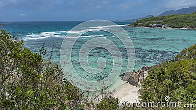 From the observation deck you can see the turquoise ocean, a secluded sandy beach Stock Photo