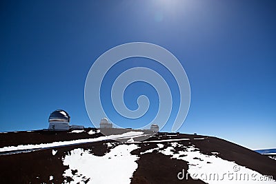 Observatory domes at the peak of Mauna Kea volcano Stock Photo