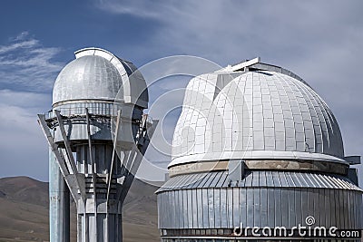 Observatory telescope on green valley among mountains mountains in day, great design for any purposes. Stock Photo