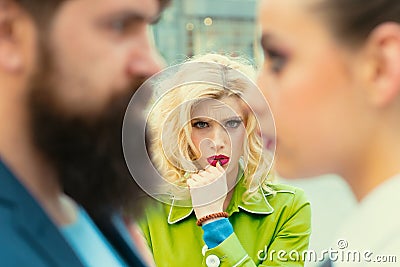 Obsessed ex girlfriend spying to a couple dating. She is obviously jealous. Bearded man cheating his girlfriend with Stock Photo