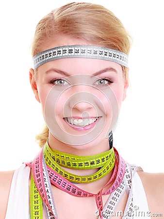 Obsessed fitness woman with a lot of colorful measure tapes Stock Photo