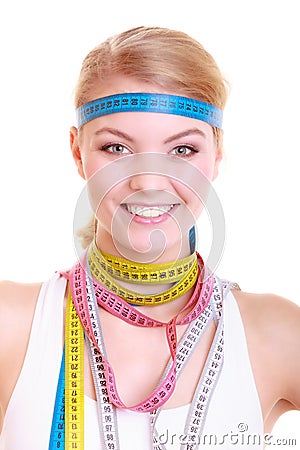 Obsessed fitness woman with a lot of colorful measure tapes Stock Photo