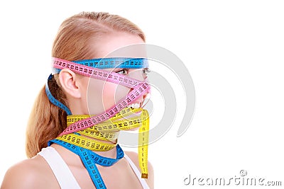 Obsessed fitness woman with a lot of colorful measure tapes Stock Photo